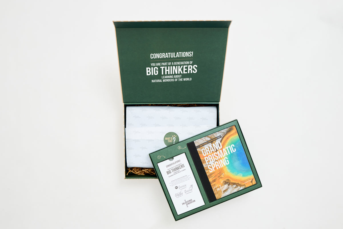 The open Grand Prismatic Spring keepsake box with the book and activity card inside